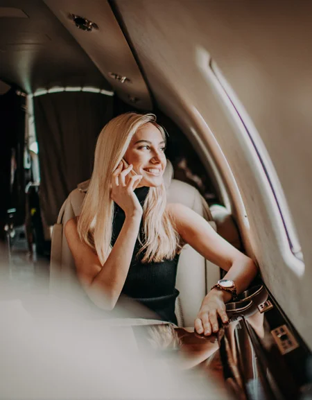 woman sitting on airplane holding cell phone Bethesda, MD